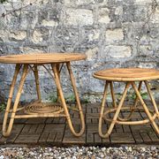 Pair of tripod coffee tables in rattan from the 1950s.