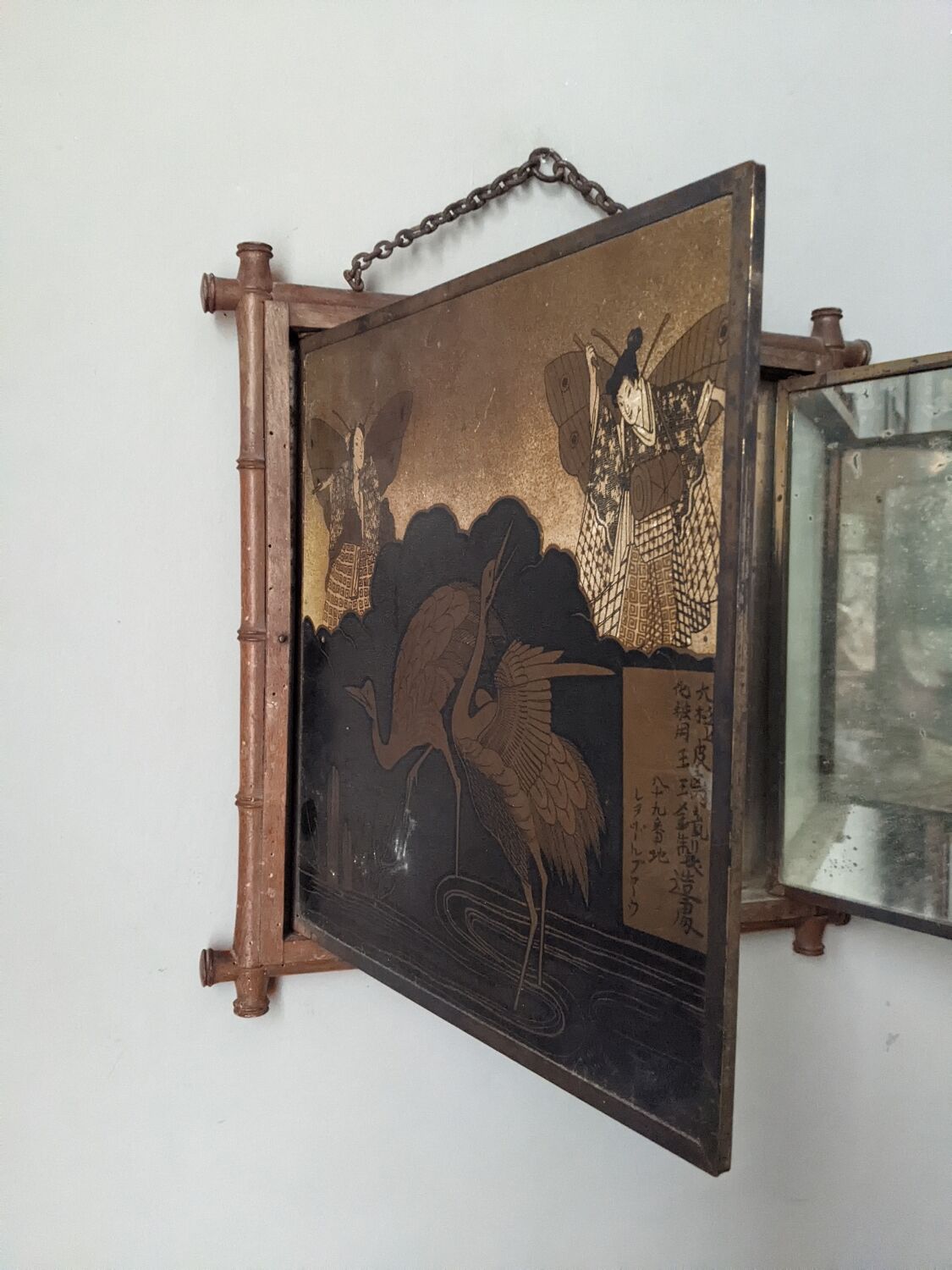 Antique Asian decorative triptych mirror with chain wall decoration in wood.