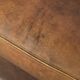 Sheepskin armchair in a light cognac colour with matching piping