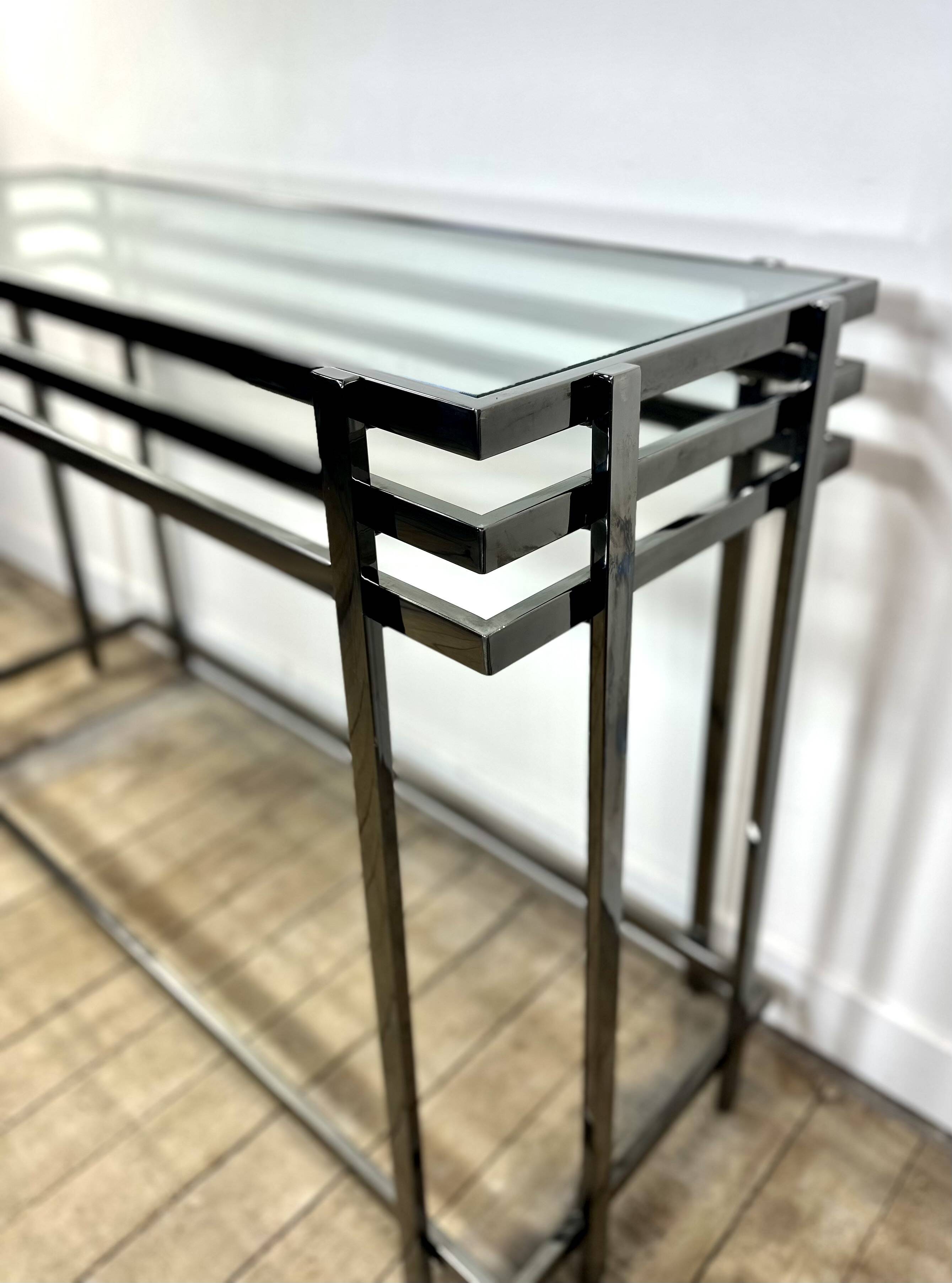 Smoked silver metal console from the 2000s.