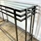 Smoked silver metal console from the 2000s.