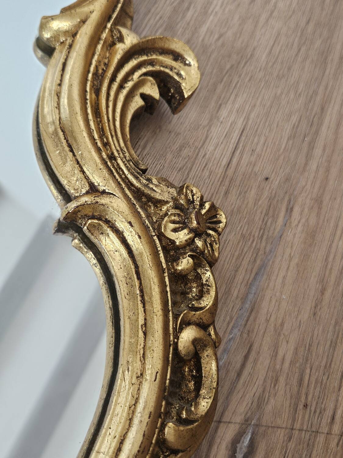 Rockery mirror under gilded frame