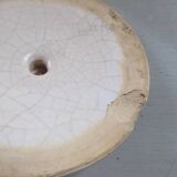 Old earthenware pitcher with its lid