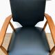 Fauteuil en teck et vinyle noir 1960