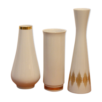 Trio of vases in white and gold porcelain