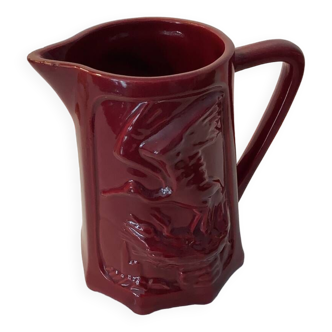 Antique slip pitcher with stork decoration
