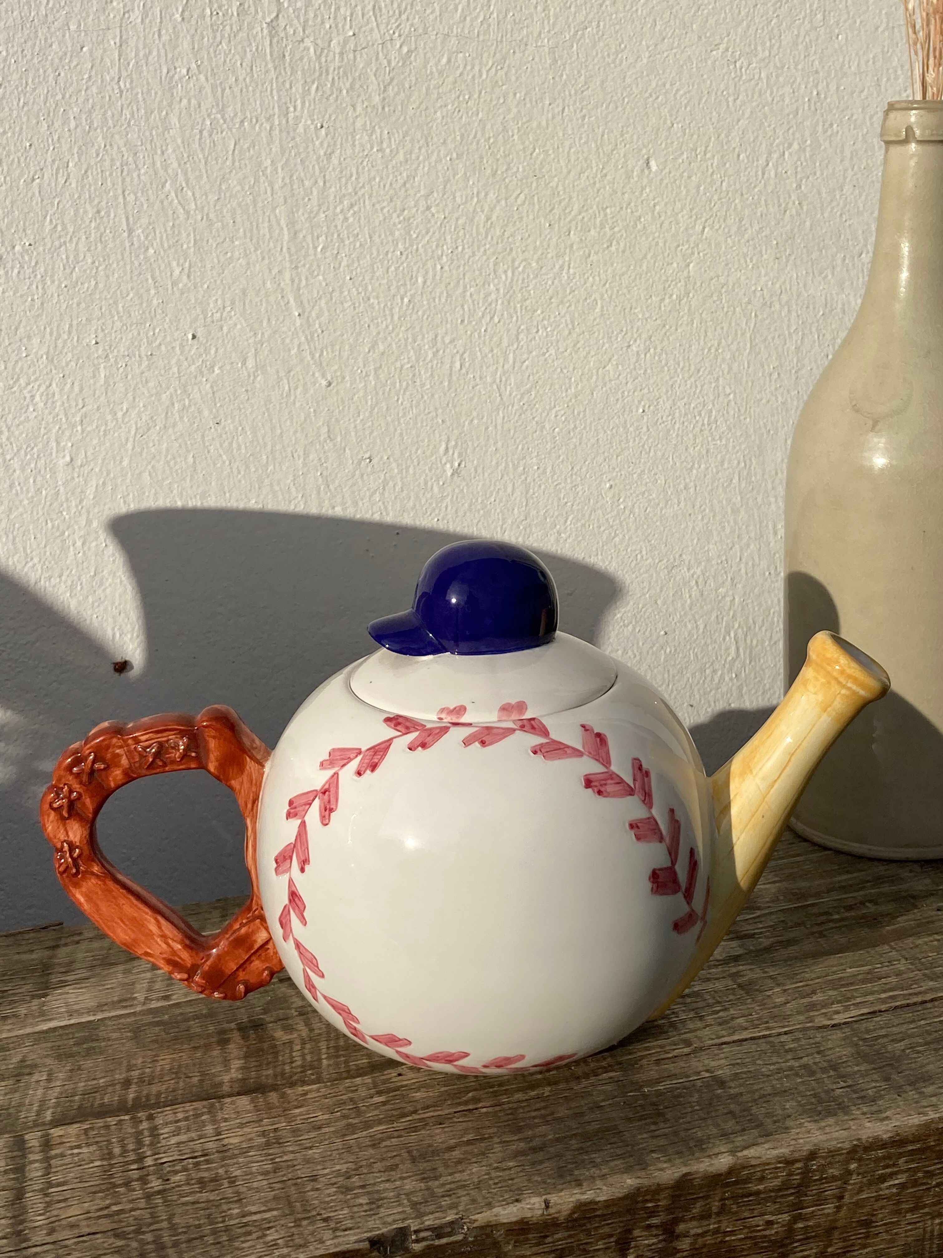 Teapot in white ceramic baseball
