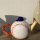 Teapot in white ceramic baseball