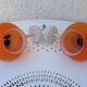 Pair of vintage orange hanging lamps