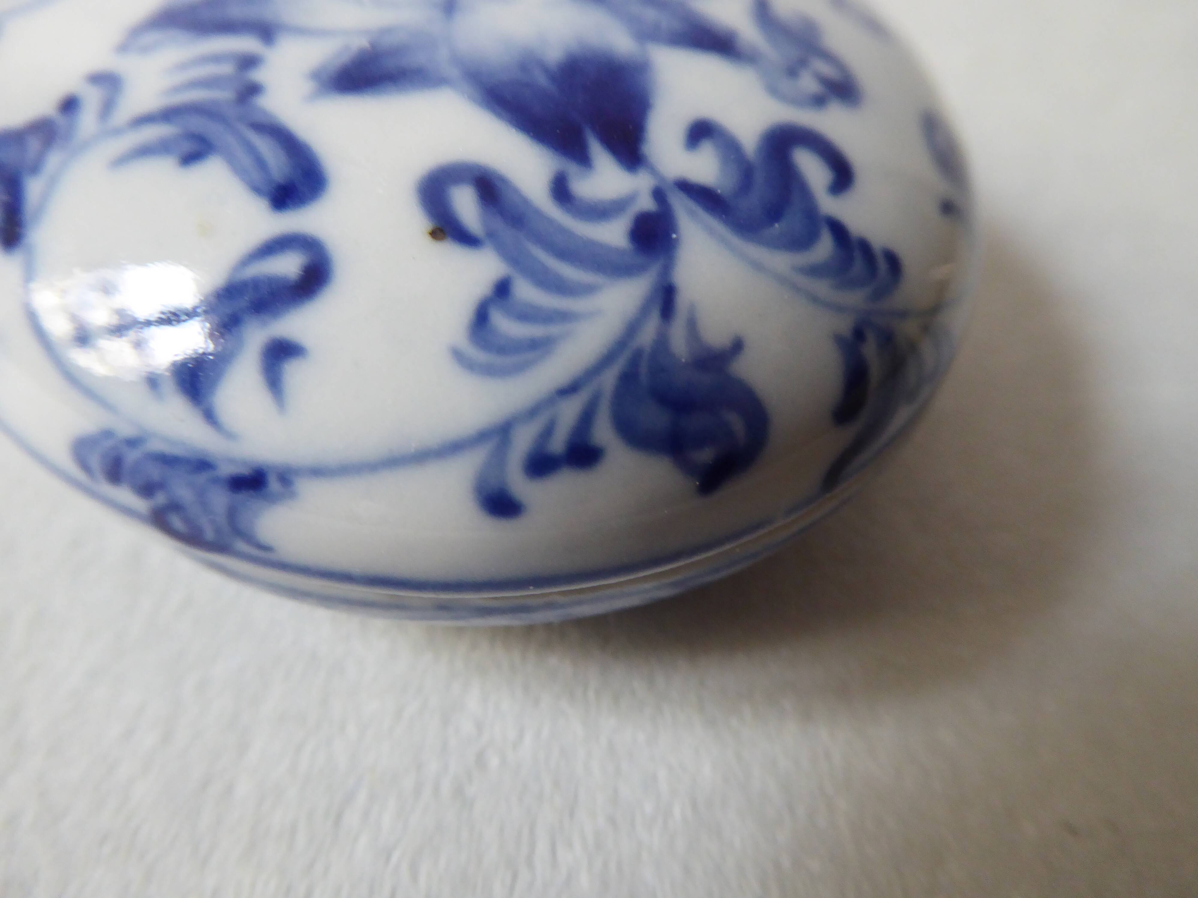 Porcelain pill box decorated with blue and white flowers