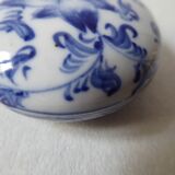 Porcelain pill box decorated with blue and white flowers
