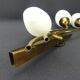 Vintage brass wall light with 3 glass tulips.