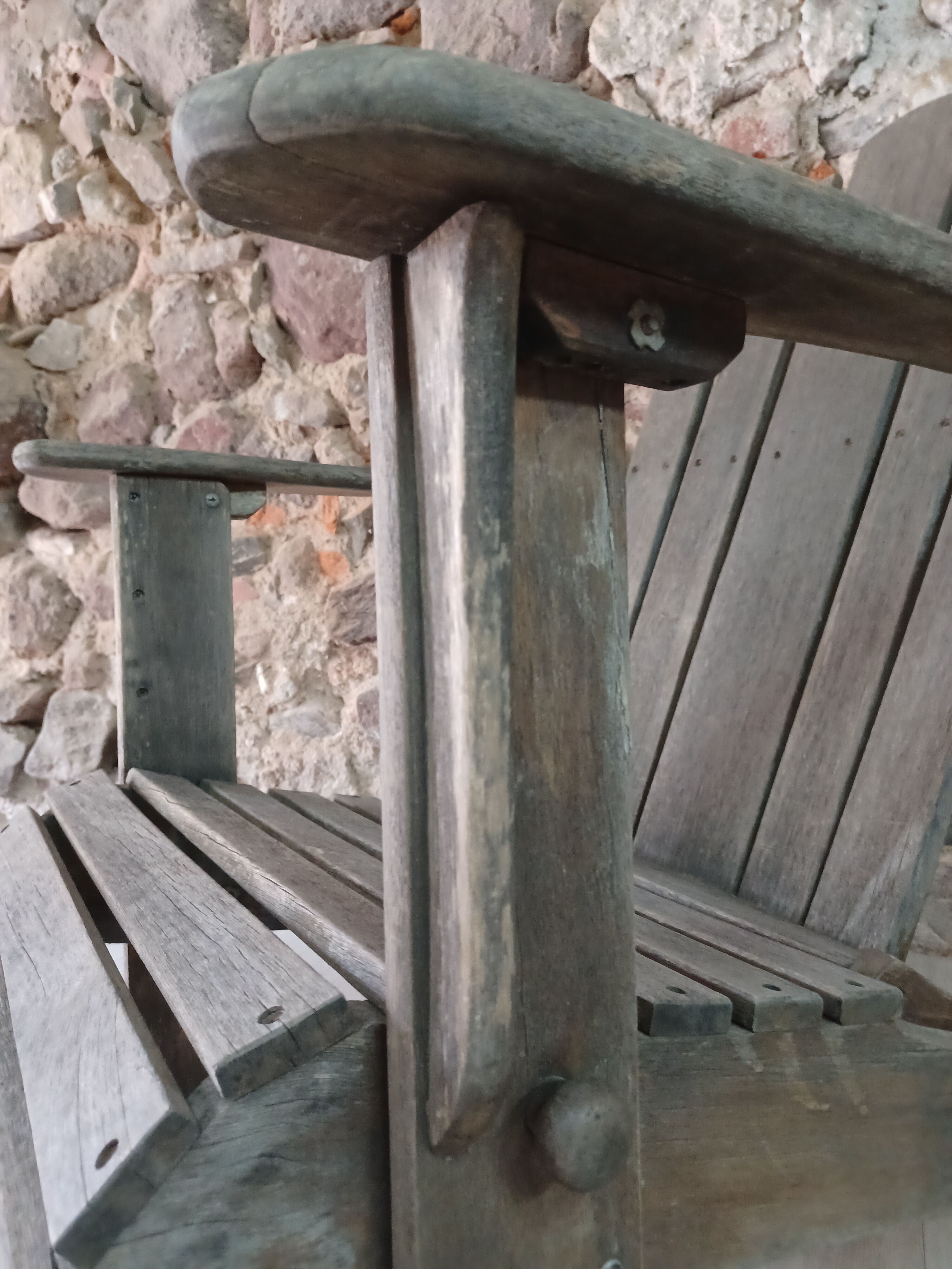 Ancient Adirondack armchair with footrest