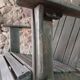 Ancient Adirondack armchair with footrest