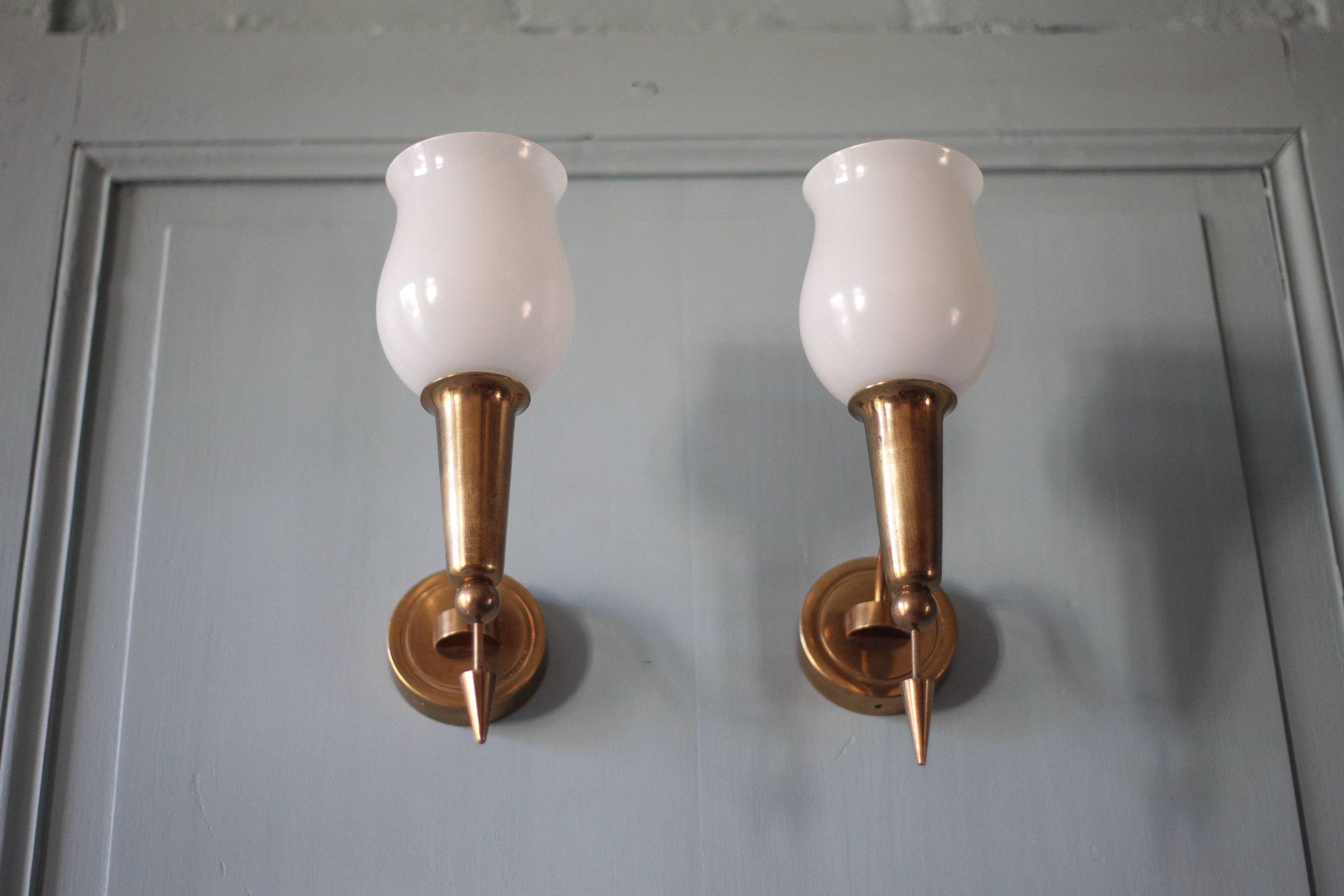 Pair of gold metal and white opaline wall sconces, wall light, sconce.