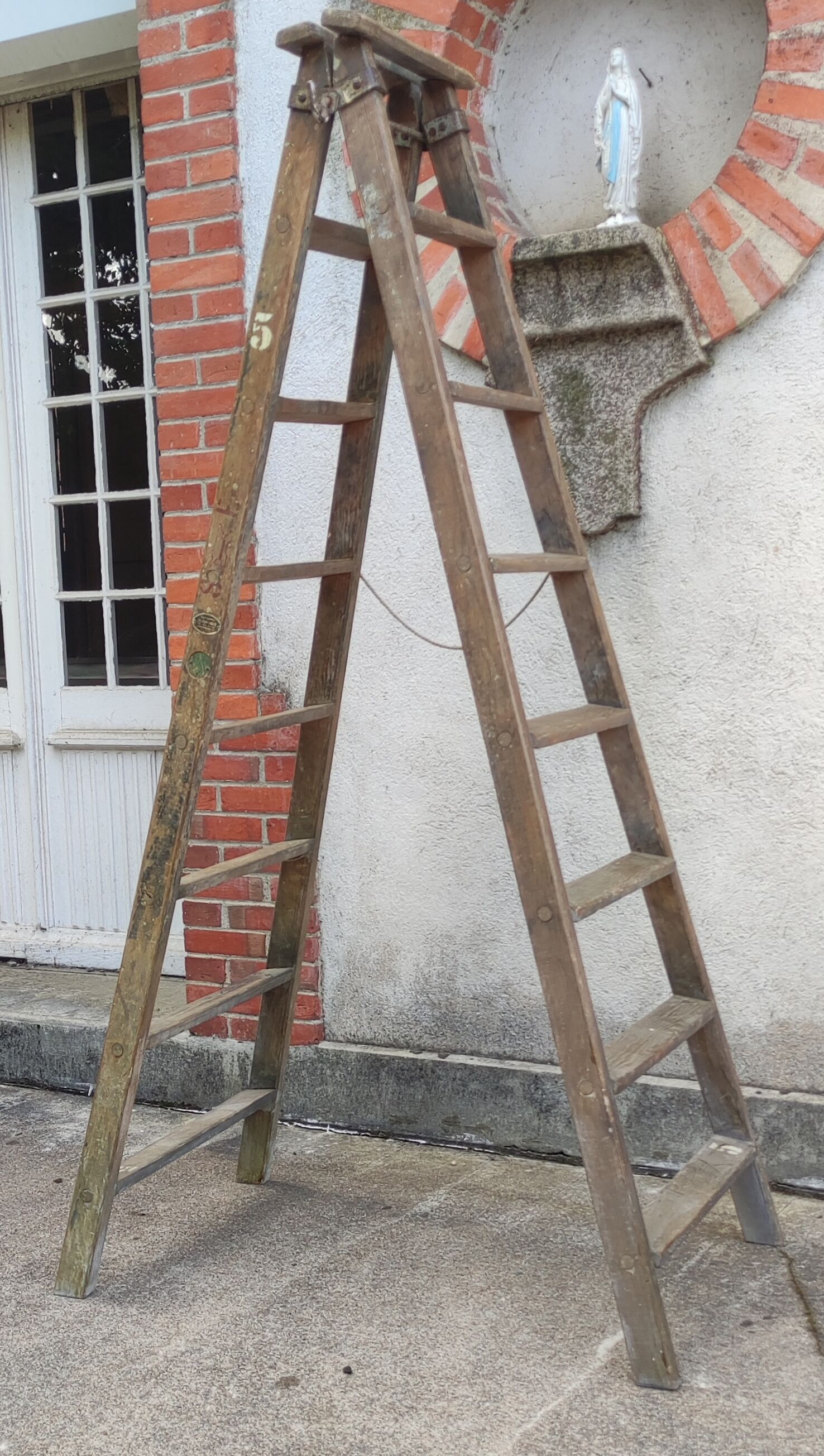 Old wooden stepladder stamped