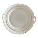 This dish appears to be a serving dish or a round plate with handles made of porcelain.