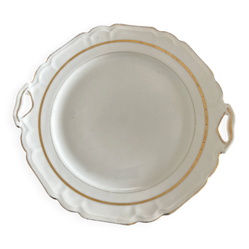 Ce plat semble être un plat de service ou une assiette ronde à anses en por