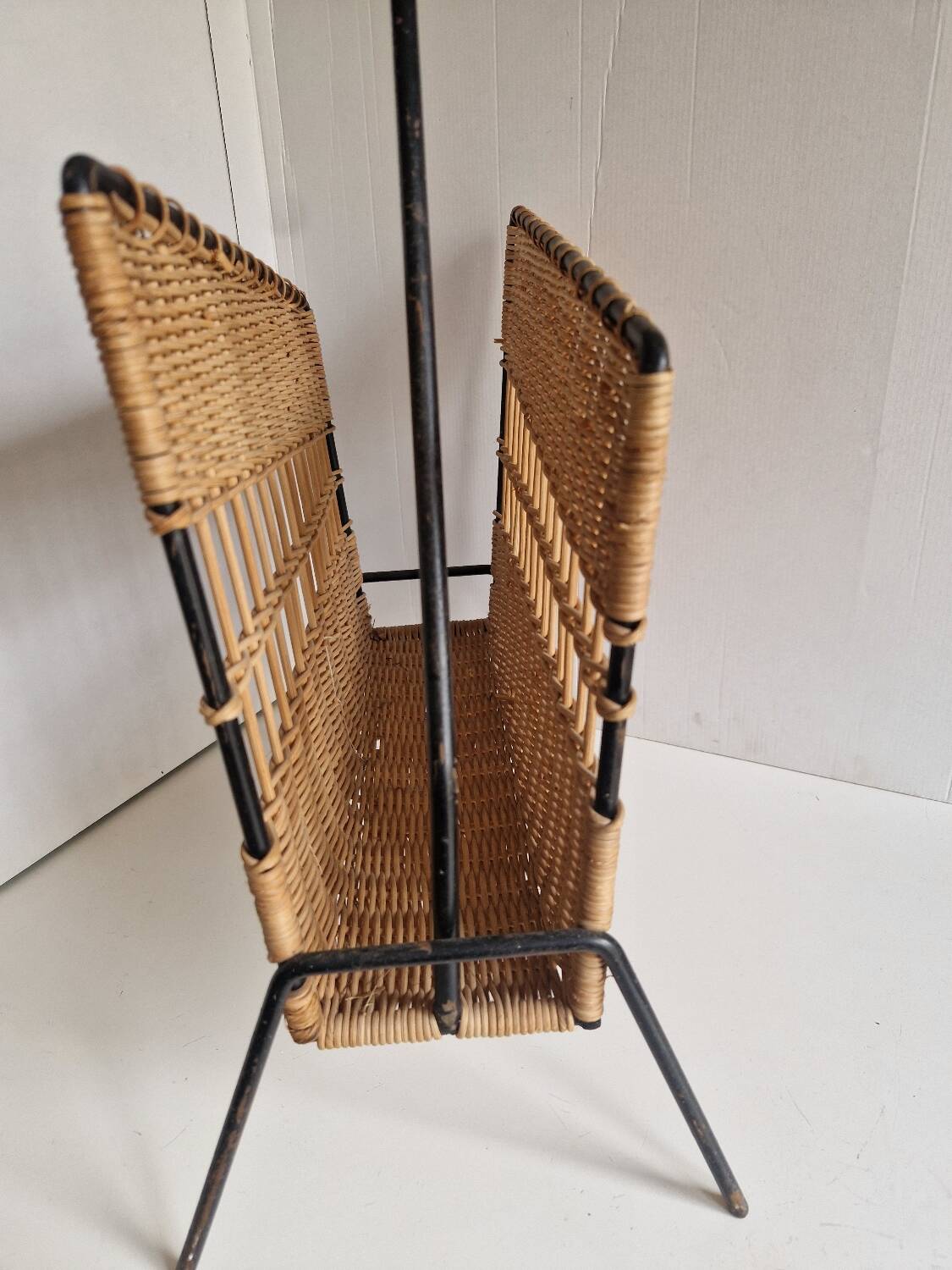 Raoul Guys magazine rack 1950s  
Rattan and black metal