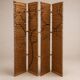 Wooden screen with slats, black plant decoration.