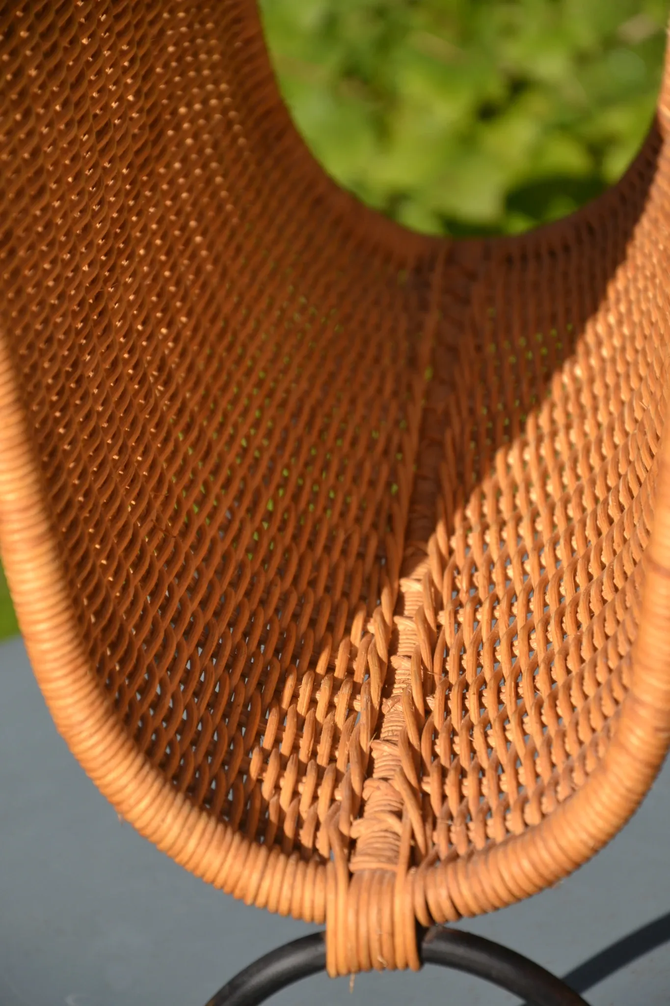 Wrought iron and rattan magazine/newspaper rack