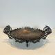Especially a silver-plated metal table with engraving, signed.