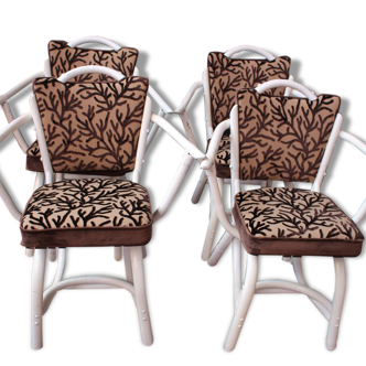 4 white rattan chairs