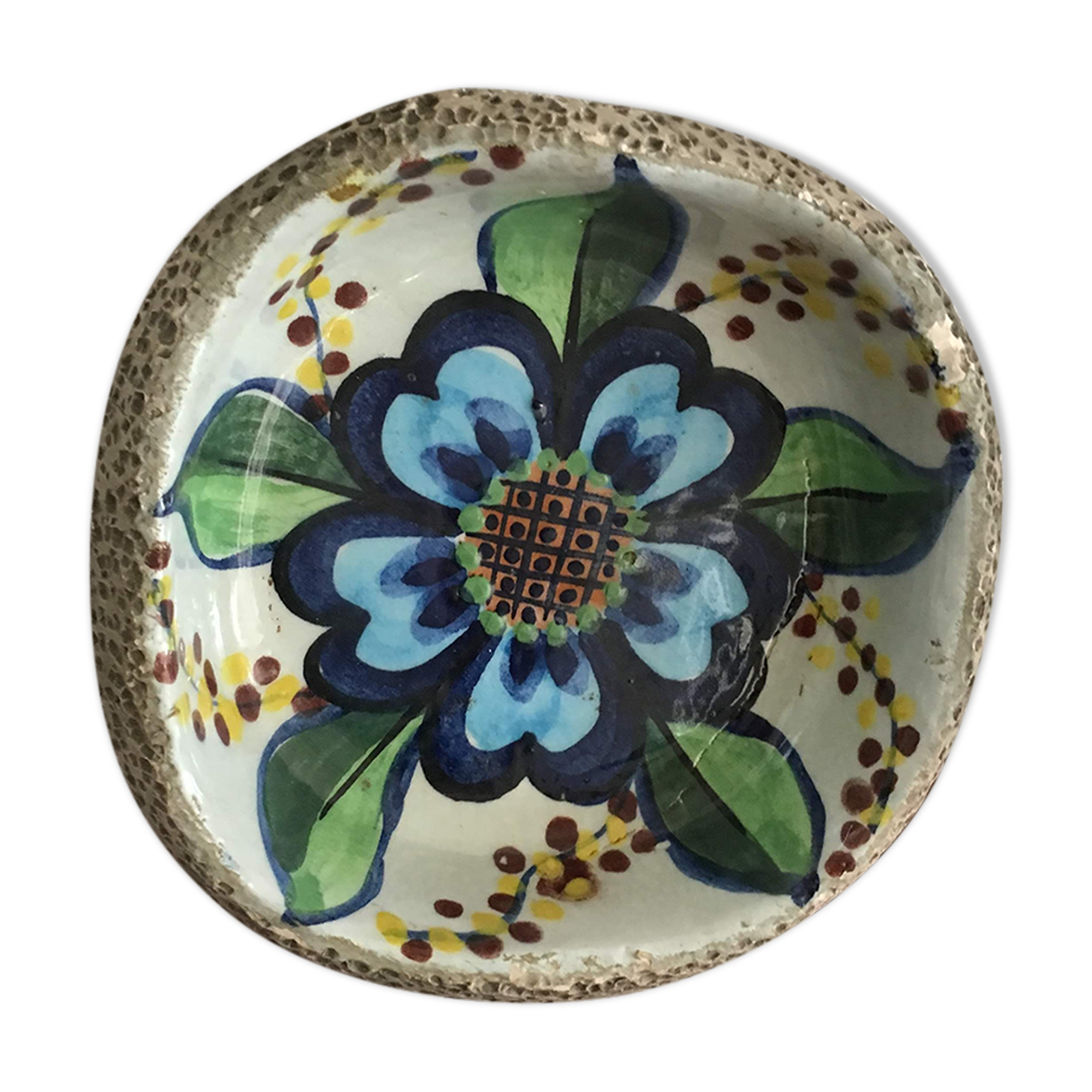 Cup lava foam with blue flower.