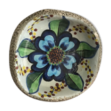 Cup lava foam with blue flower.