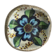 Cup lava foam with blue flower.