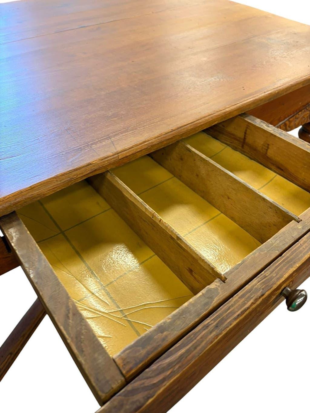 Vintage solid wood table with X-cross on wheels.