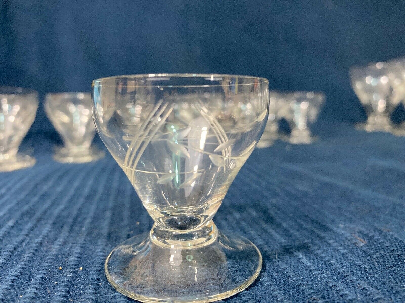 Set of 12 hand-sized crystal glasses with flower decoration
