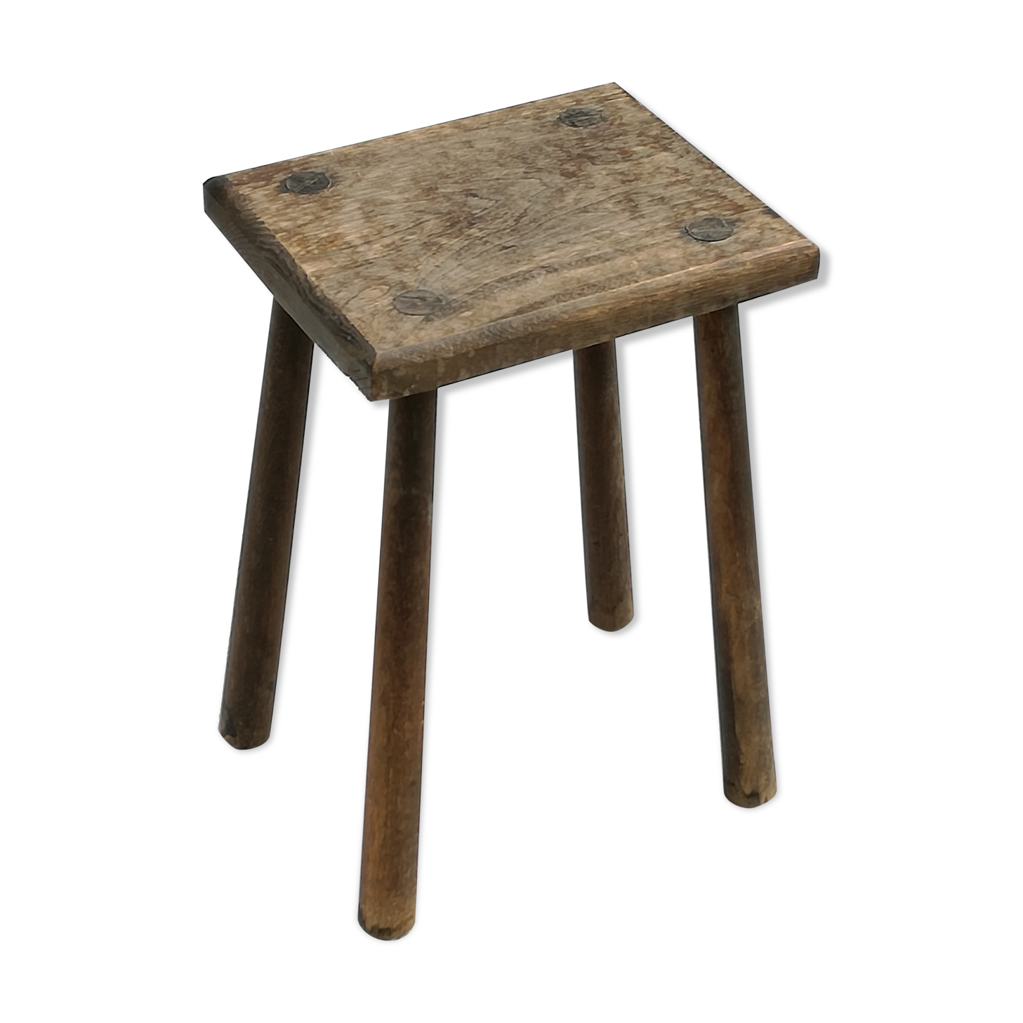 Old wooden stool with log feet