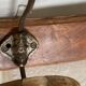 19th-century wall coat rack with 2 metal and horn hooks.