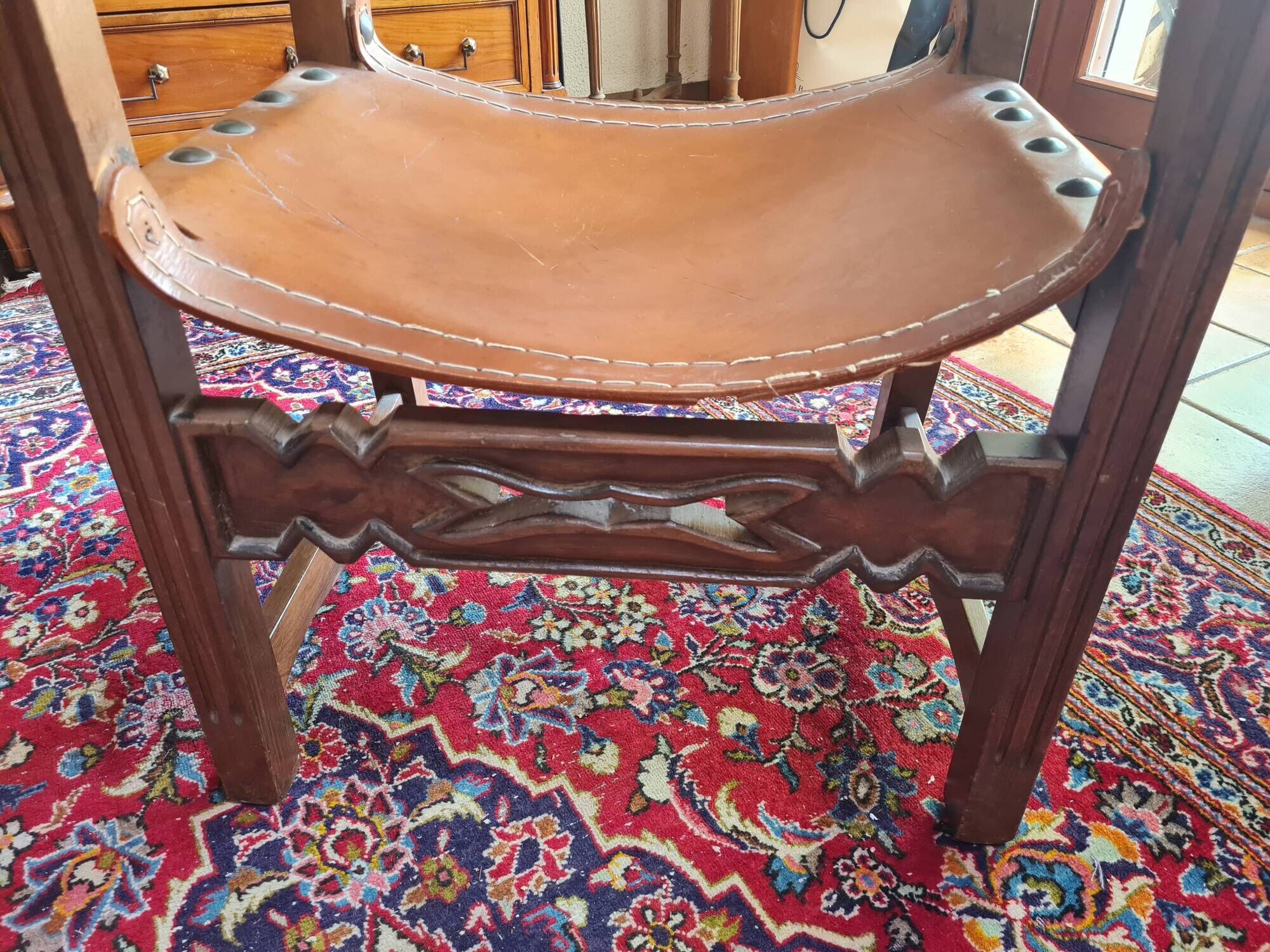 Frailero armchair, antique Spanish — carved wood & full-grain leather throne.