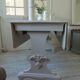 Console table in walnut with drop-leaf extensions, grey patinated base.