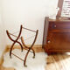 Vintage rattan cradle and its wheeled support