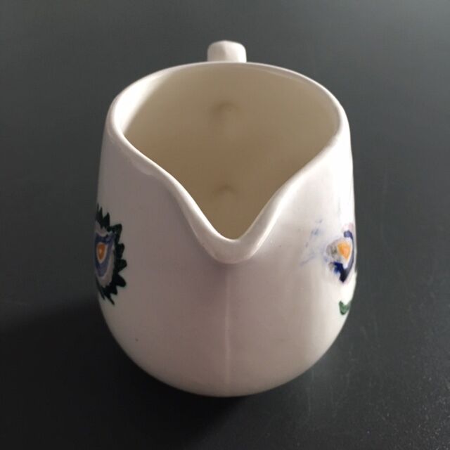 Signed floral decoration pitcher
