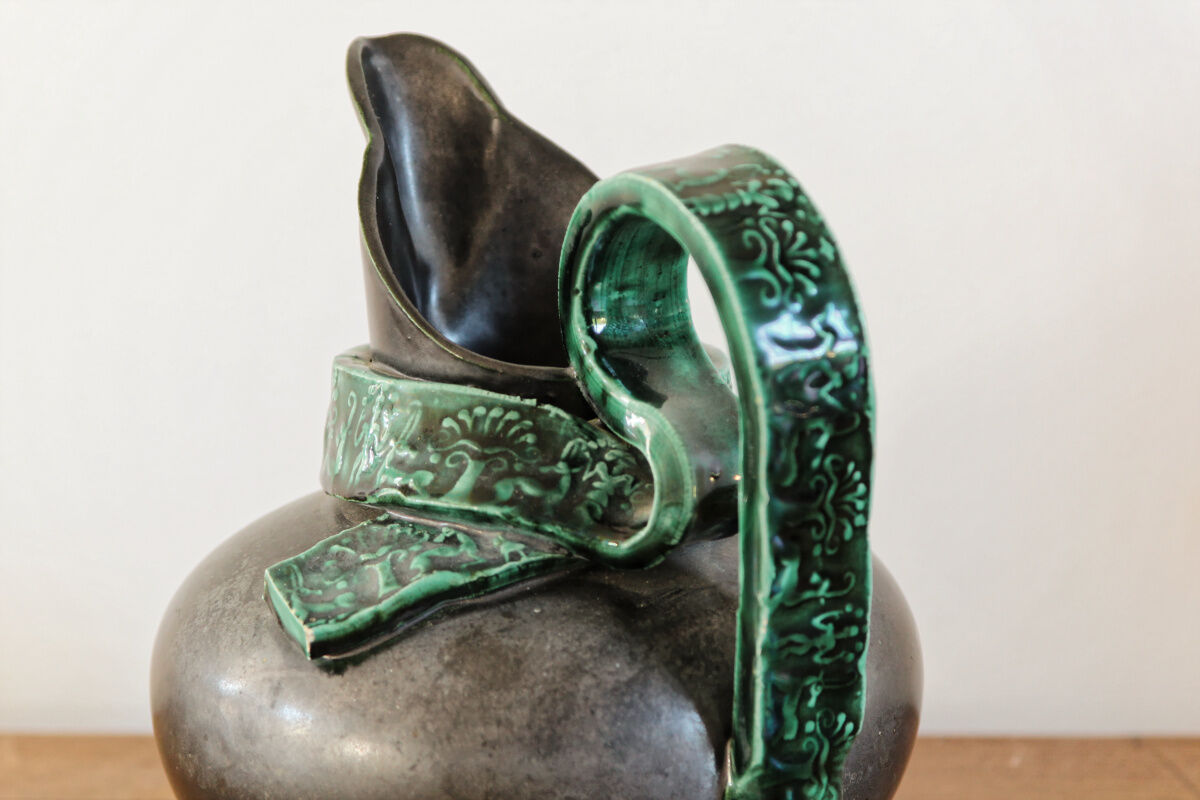 Pitcher in earthenware, metallic black