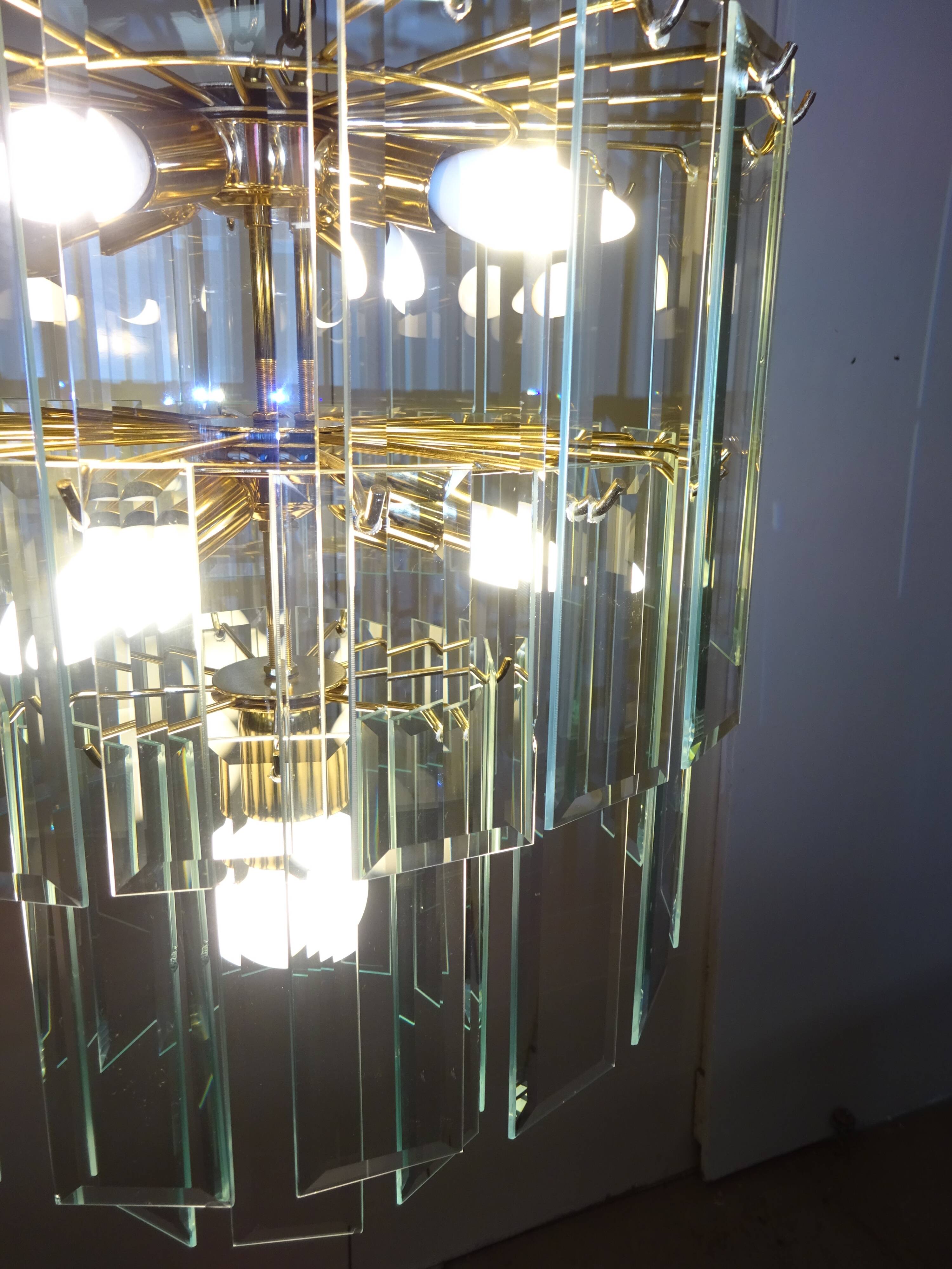 Brass chandelier and beveled glass, Italian manufacturing