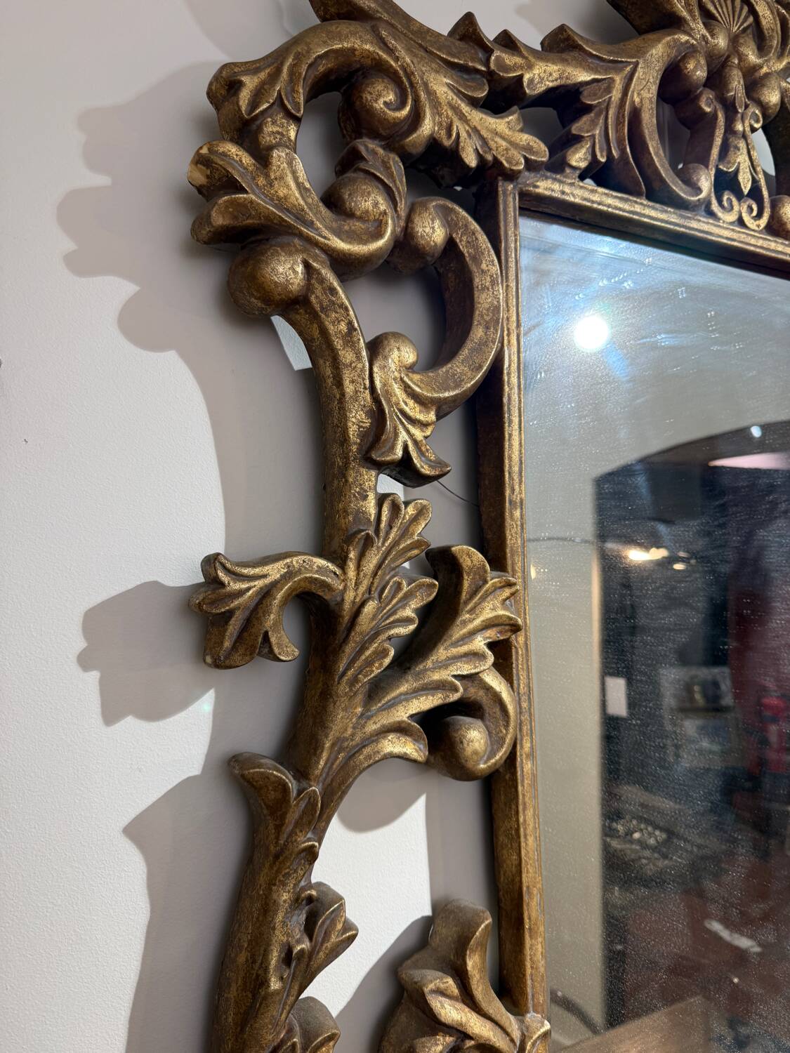Gold wooden wall mirror with floral decoration