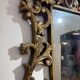 Gold wooden wall mirror with floral decoration
