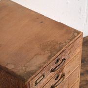 Small Japanese desk chest in oak and red pine, mid-Showa period, circa 1945–1970.