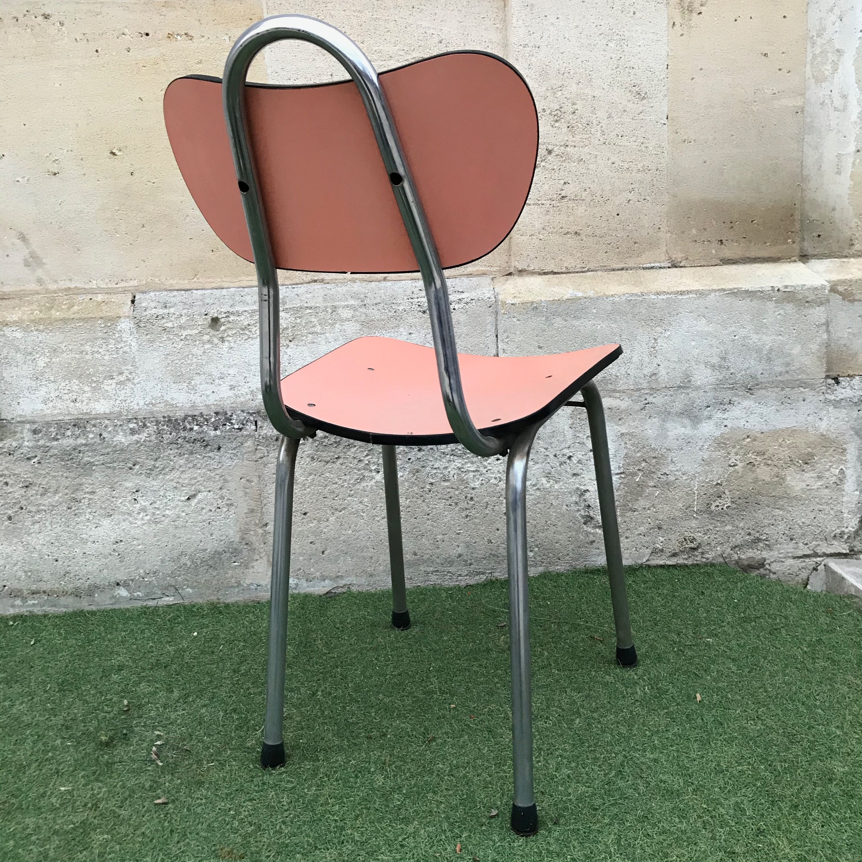 Pink chair in formica