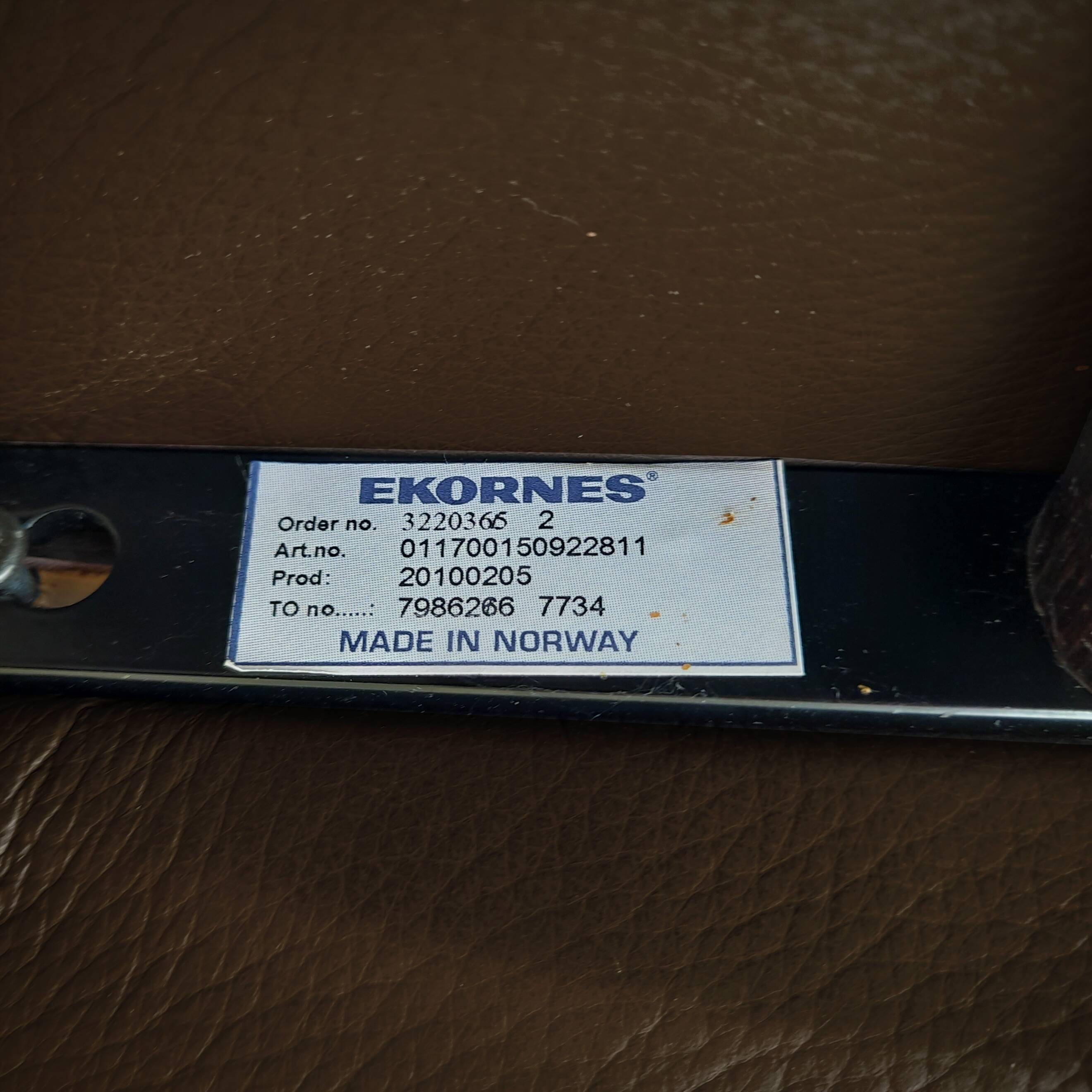 Pair of Scandinavian leather armchairs and ottoman, Ekornes, Norway, 1970s