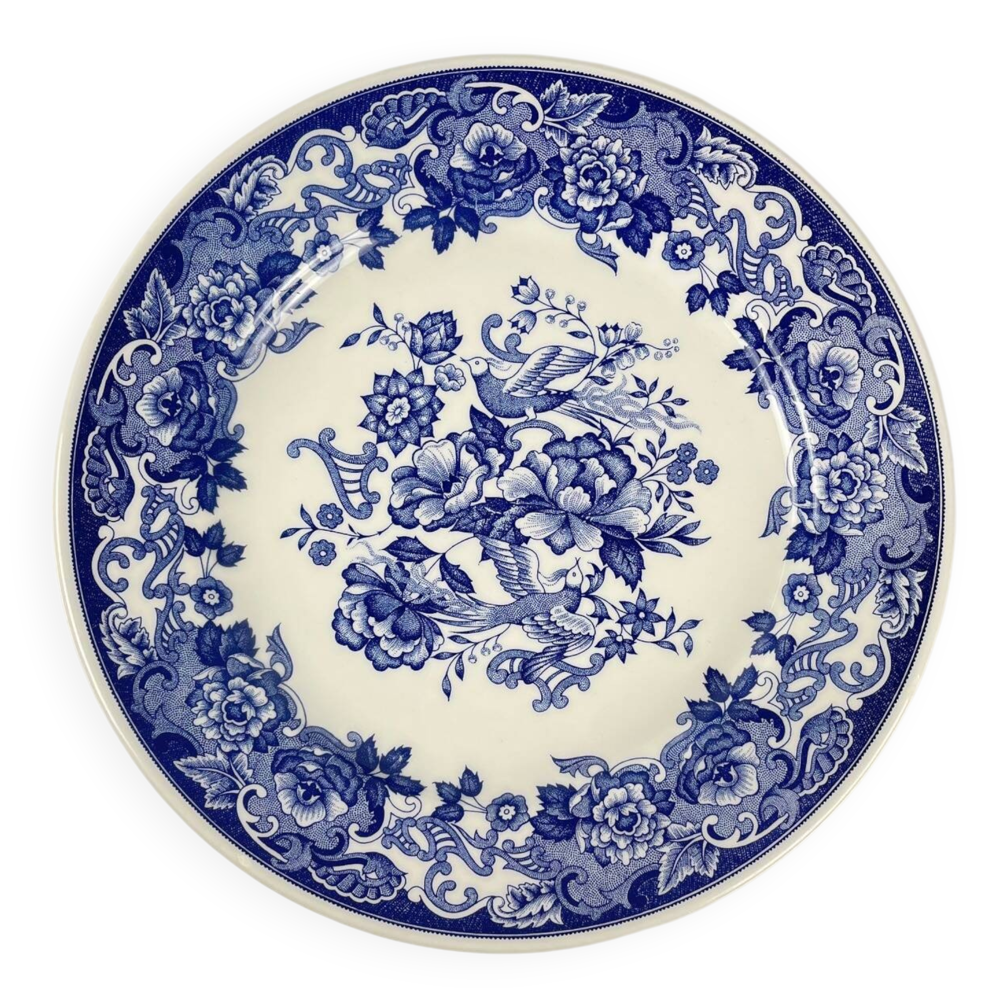 Plat ancien en faïence bleue, décor floral et oiseaux, début XXe