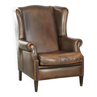 Large sheepskin wingback armchair with beautiful warm colours