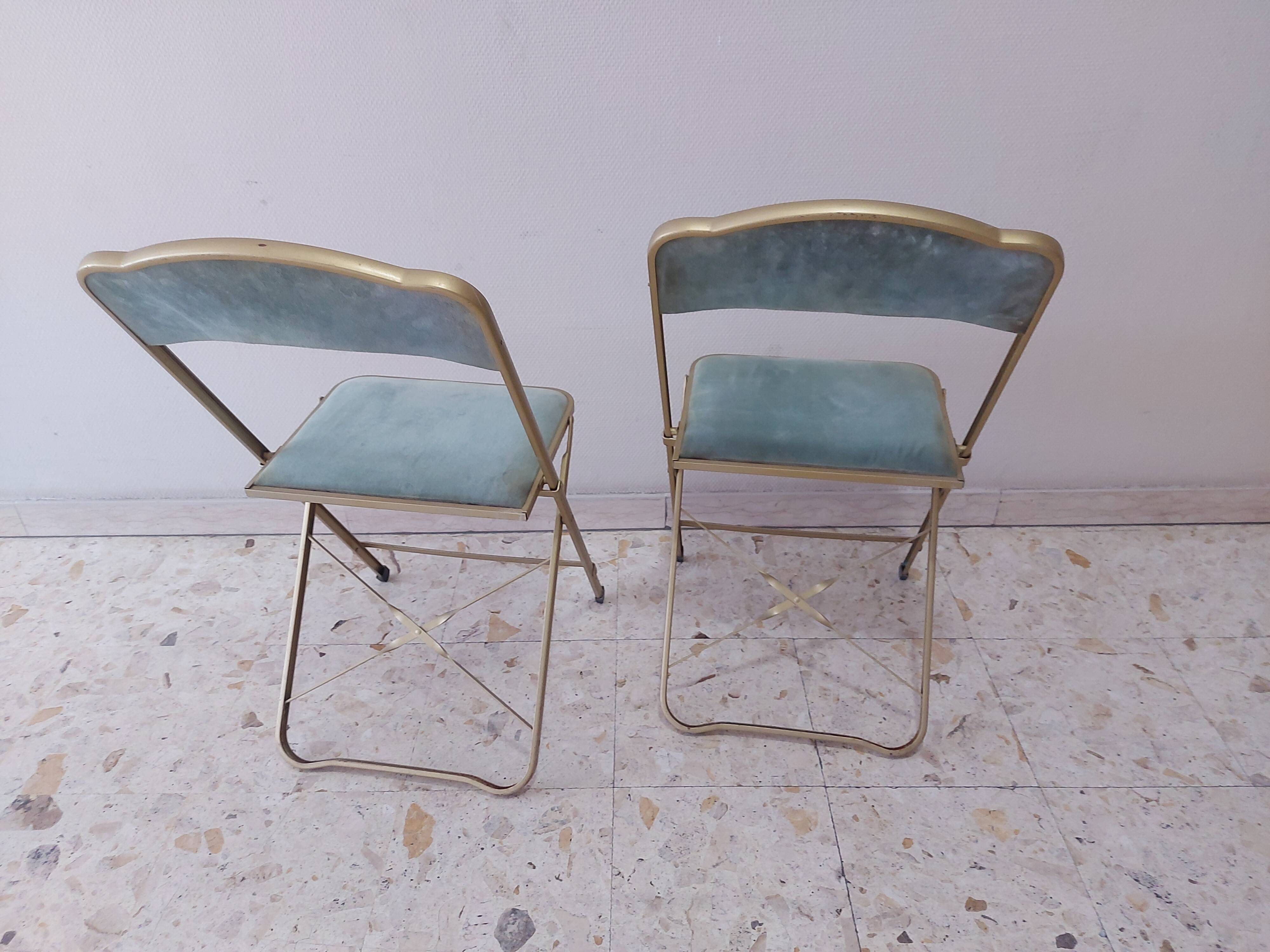 Two folding opera chairs in velvet