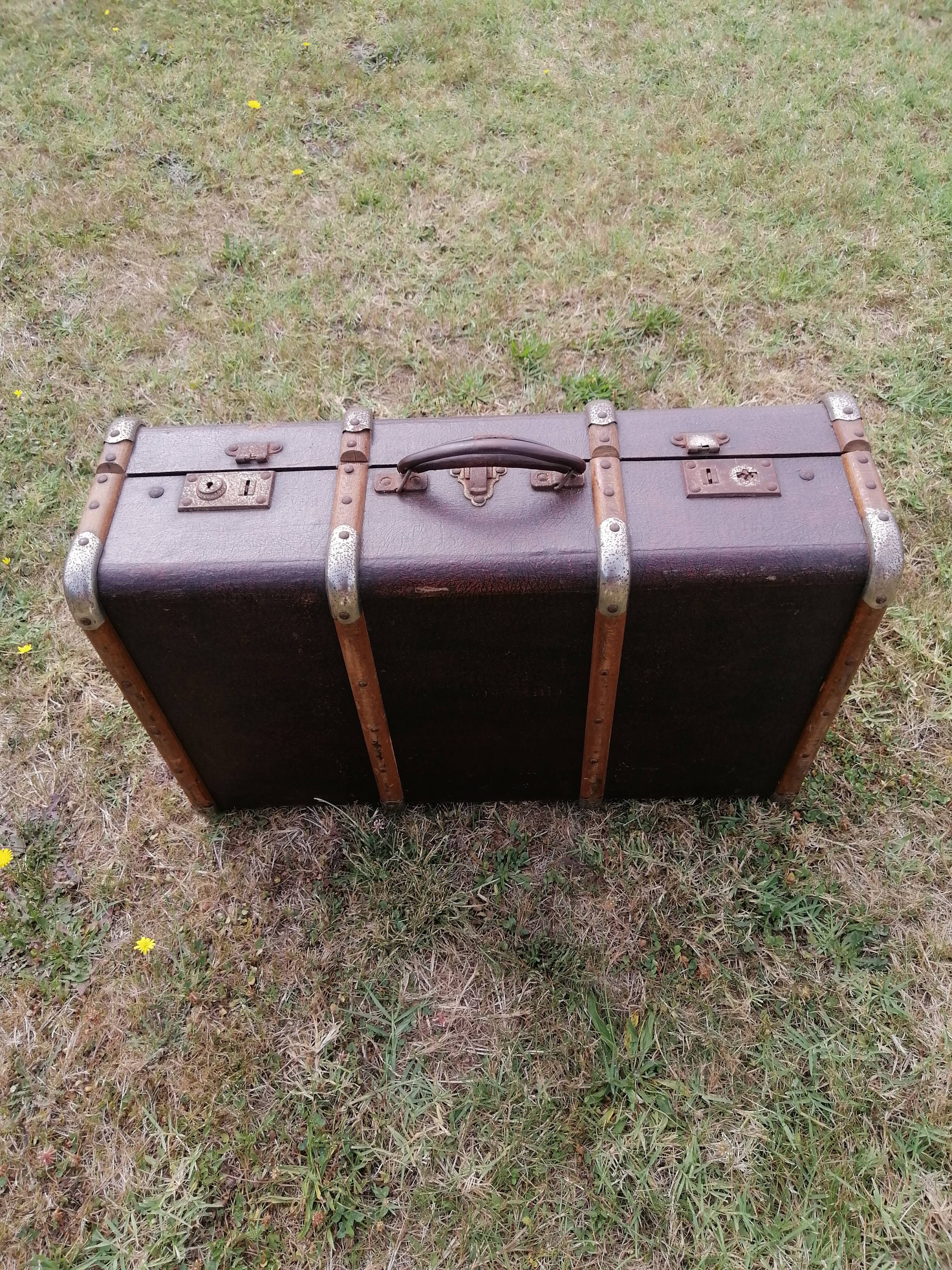 Antique suitcase in leather wood and vintage metal