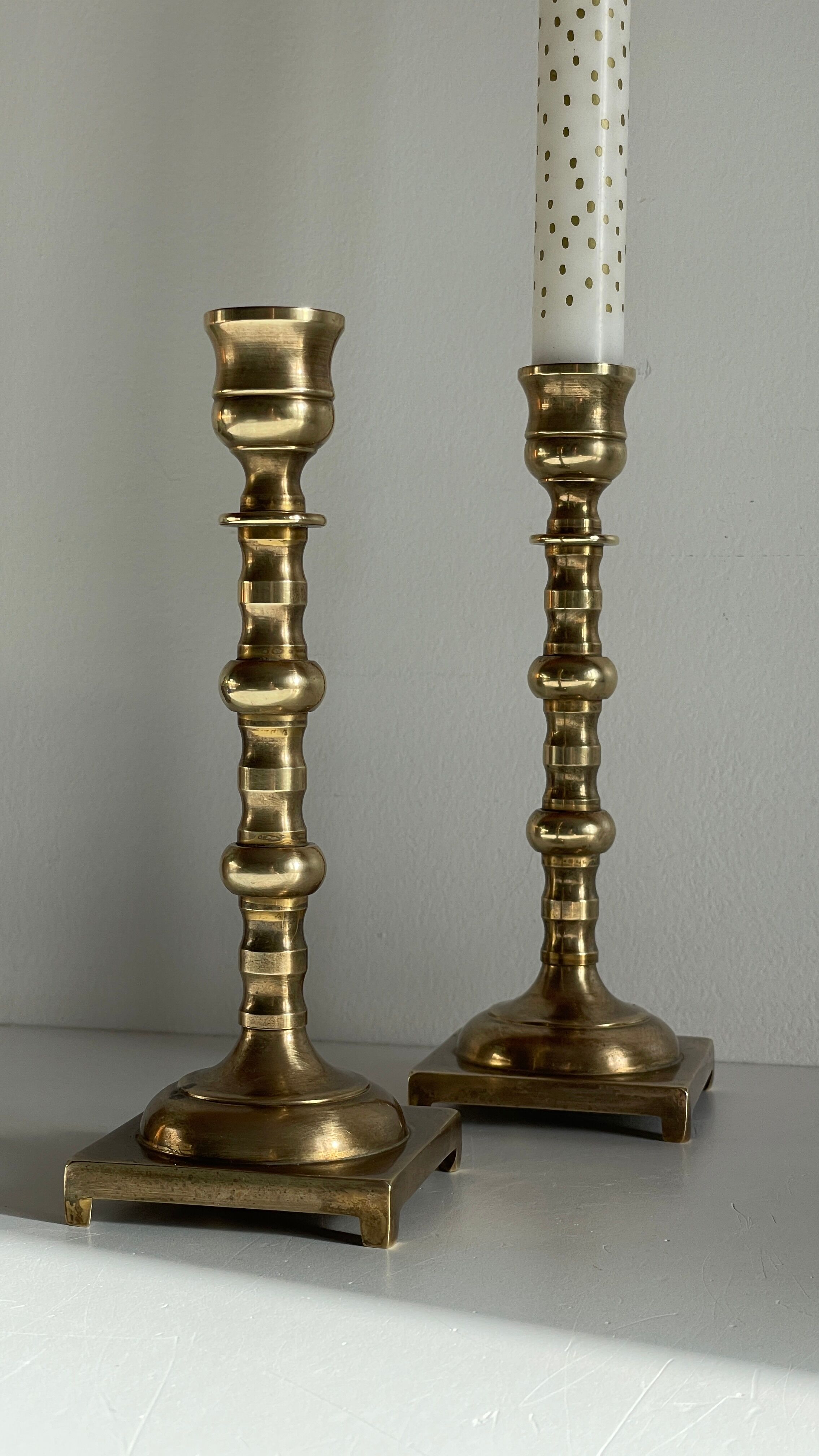 Pair of brass candle holders made in England